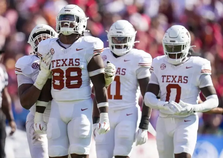 Texas Longhorns linebacker Barryn Sorrell (88) and Texas Longhorns defensive lineman Vernon Broughton (45) celebrates a tackle. For a lost against Oklahoma Sooners during the Red River Rivalry Football Game between the University of Oklahoma Sooners and the University of Texas Longhorns at the Cotton Bowl Stadium in Dallas, TX.