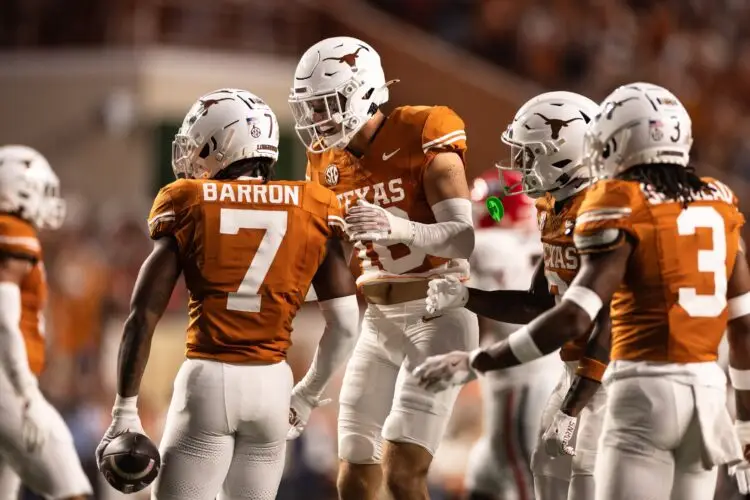 Oct 19, 2024; Austin, Texas, USA; Texas Longhorns safety Jahdae Barron (7) celebrates after making an interception against the Georgia Bulldogs during the first half at Darrell K Royal-Texas Memorial Stadium. Mandatory Credit: Brett Patzke-Imagn Images