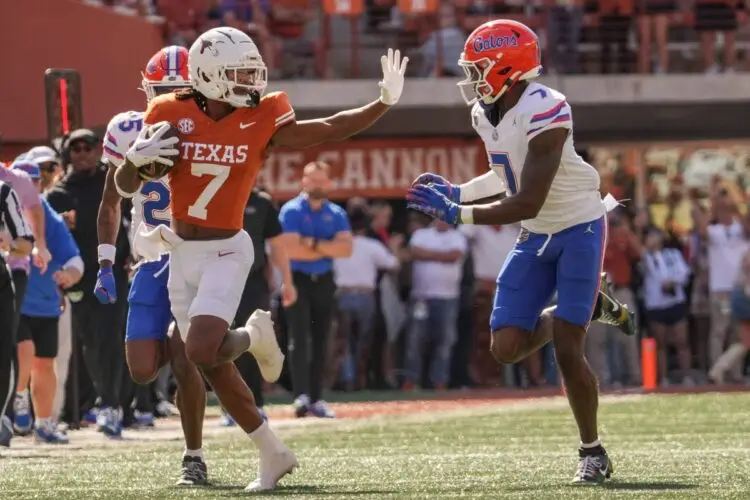 Texas Longhorns wide receiver Isaiah Bond (7) advances the ball as Florida Gators defensive back Trikweze Bridges (7) attempts to guard him during the Longhorns' game against the Florida Gators, Nov. 9, 2024 at Darrell K. Royal Texas Memorial Stadium in Austin.