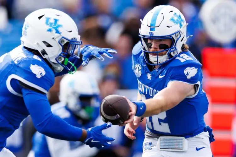 Nov 16, 2024; Lexington, Kentucky, USA; Kentucky Wildcats quarterback Brock Vandagriff (12) hands the ball off to running back Demie Sumo-Karngbaye (0) during the first quarter against the Murray State Racers at Kroger Field. Mandatory Credit: Jordan Prather-Imagn Images