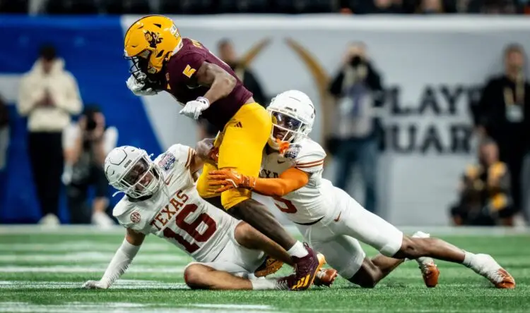 Texas Longhorns defensive backs Malik Muhammad (5) and Michael Taaffe (16) work together to bring down Arizona State Sun Devils wide receiver Melquan Stovall (5) in the fourth quarter as the Texas Longhorns play the Arizona State Sun Devils in the Peach Bowl College Football Playoff quarterfinal at Mercedes-Benz Stadium in Atlanta, Georgia, Jan. 1, 2025. Photo: Sara Diggins/American-Statesman / USA TODAY NETWORK via Imagn Images