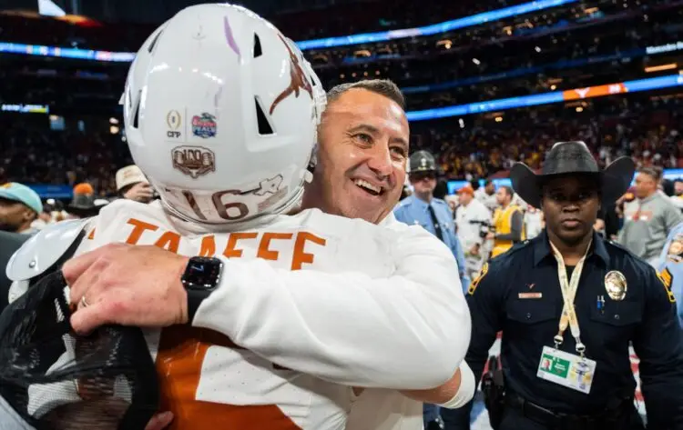 Texas Longhorns head coach Steve Sarkisian embraces Texas Longhorns defensive back Michael Taaffe (16) as they celebrate their win in the Peach Bowl College Football Playoff quarterfinal against Arizona State at Mercedes-Benz Stadium in Atlanta, Georgia, Jan. 1, 2025. Photo: Sara Diggins/American-Statesman / USA TODAY NETWORK via Imagn Images