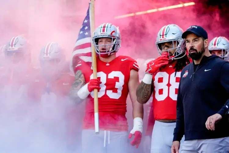 Ohio State Buckeyes defensive end Jack Sawyer (33), tight end Gee Scott Jr. (88) and head coach Ryan Day wait to take the field before the game against the Purdue Boilermakers at Ohio Stadium on Saturday, Nov. 9, 2024 in Columbus, Ohio.