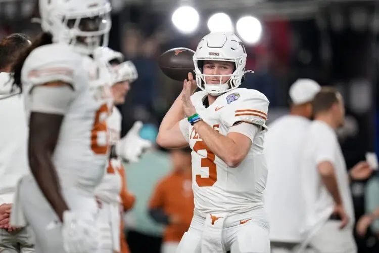 Texas Longhorns quarterback Quinn Ewers (3) warms up prior to the Cotton Bowl Classic College Football Playoff semifinal game between the Ohio State Buckeyes and the Texas Longhorns at AT&T Stadium in Arlington, Texas on Jan. 10, 2025. Photo: Adam Cairns/Columbus Dispatch / USA TODAY NETWORK via Imagn Images