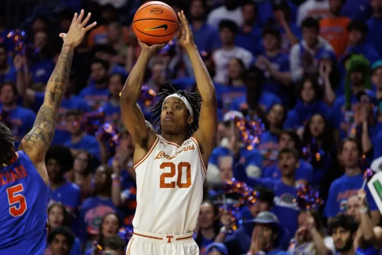Jan 18, 2025; Gainesville, Florida, USA; Texas Longhorns guard Tre Johnson (20) shoots over Florida Gators guard Will Richard (5) during the first half at Exactech Arena at the Stephen C. O'Connell Center. Mandatory Credit: Matt Pendleton-Imagn Images