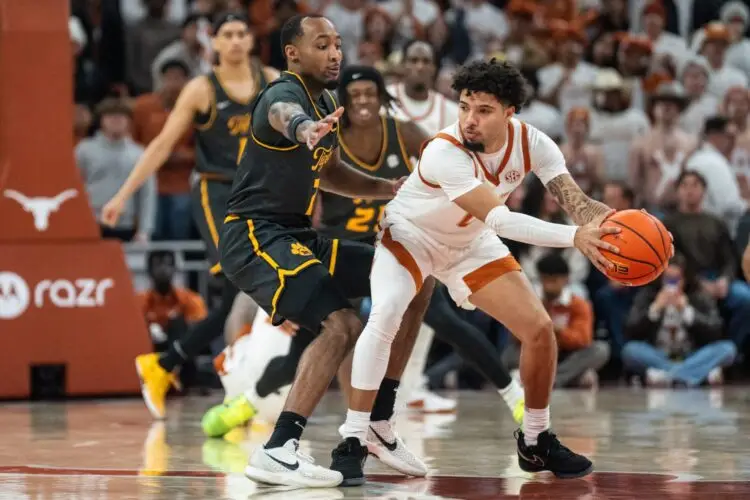 Texas Longhorns guard Jordan Pope (0) protects the ball from Missouri Tigers center Trent Burns (7) as the Longhorns take on Mizzou at the Moody Center on Jan. 21, 2025. Photo: Mikala Compton/American-Statesman / USA TODAY NETWORK via Imagn Images