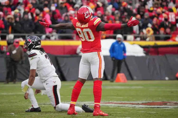 Jan 18, 2025; Kansas City, Missouri, USA; Kansas City Chiefs defensive end Charles Omenihu (90) celebrates after sacking Houston Texans quarterback C.J. Stroud (7) during the second quarter of a 2025 AFC divisional round game at GEHA Field at Arrowhead Stadium. Mandatory Credit: Denny Medley-Imagn Images
