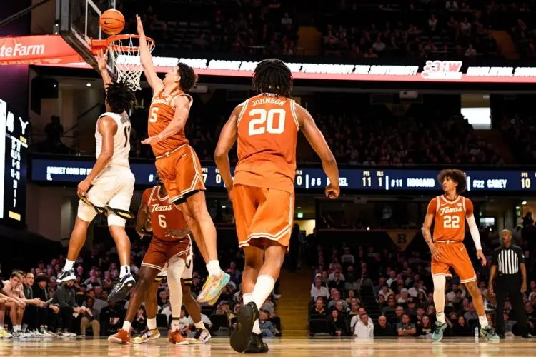 Feb 8, 2025; Nashville, Tennessee, USA; Texas Longhorns forward Kadin Shedrick (5) blocks the shot of Vanderbilt Commodores guard AJ Hoggard (11) during the second half at Memorial Gymnasium. Mandatory Credit: Steve Roberts-Imagn Images