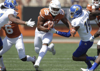 Texas Rushing Attack Delivers 56-0 Rout of Spartans